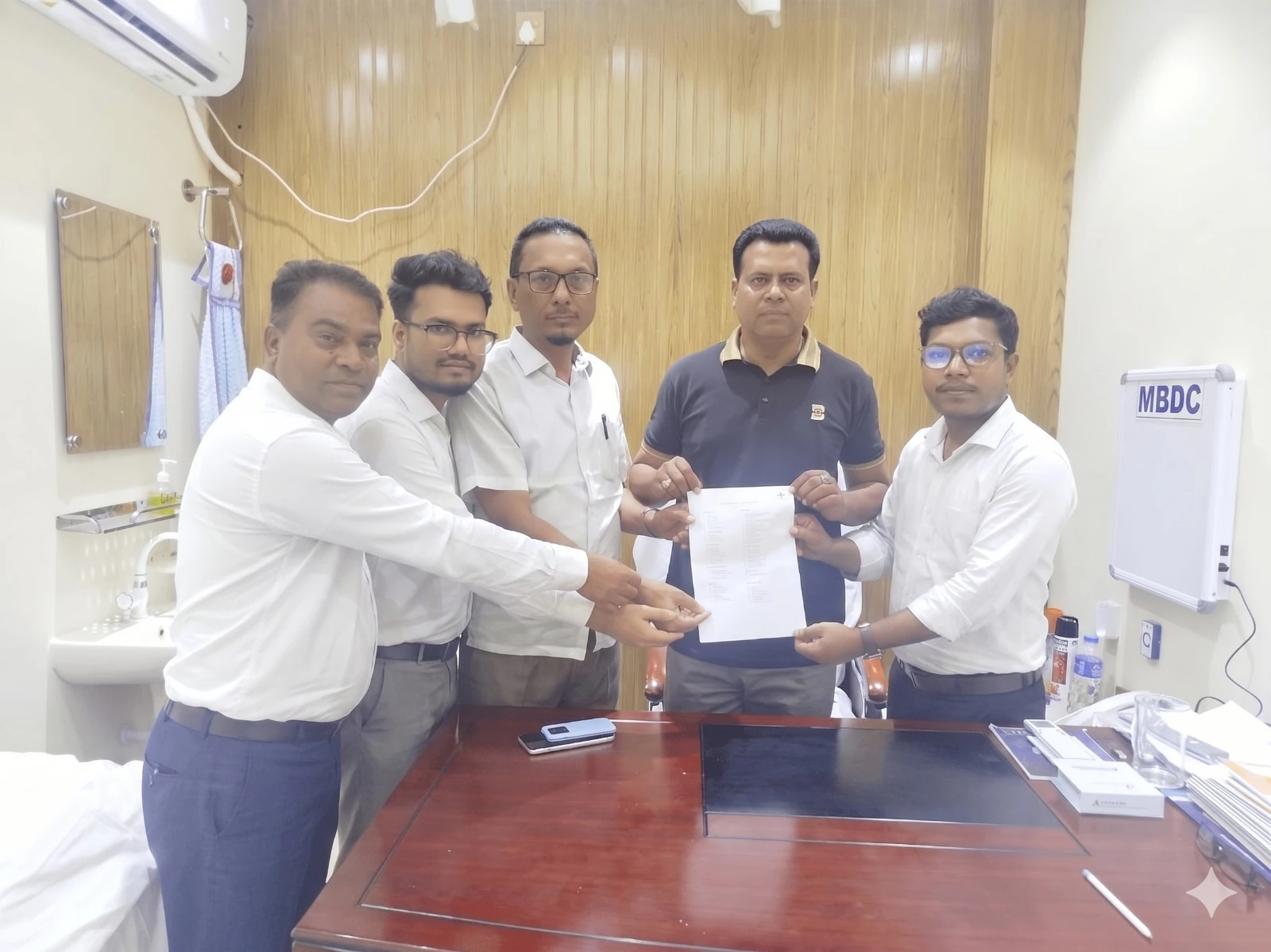 MacroHealthPlus implementation team completing a software handover with a healthcare organization